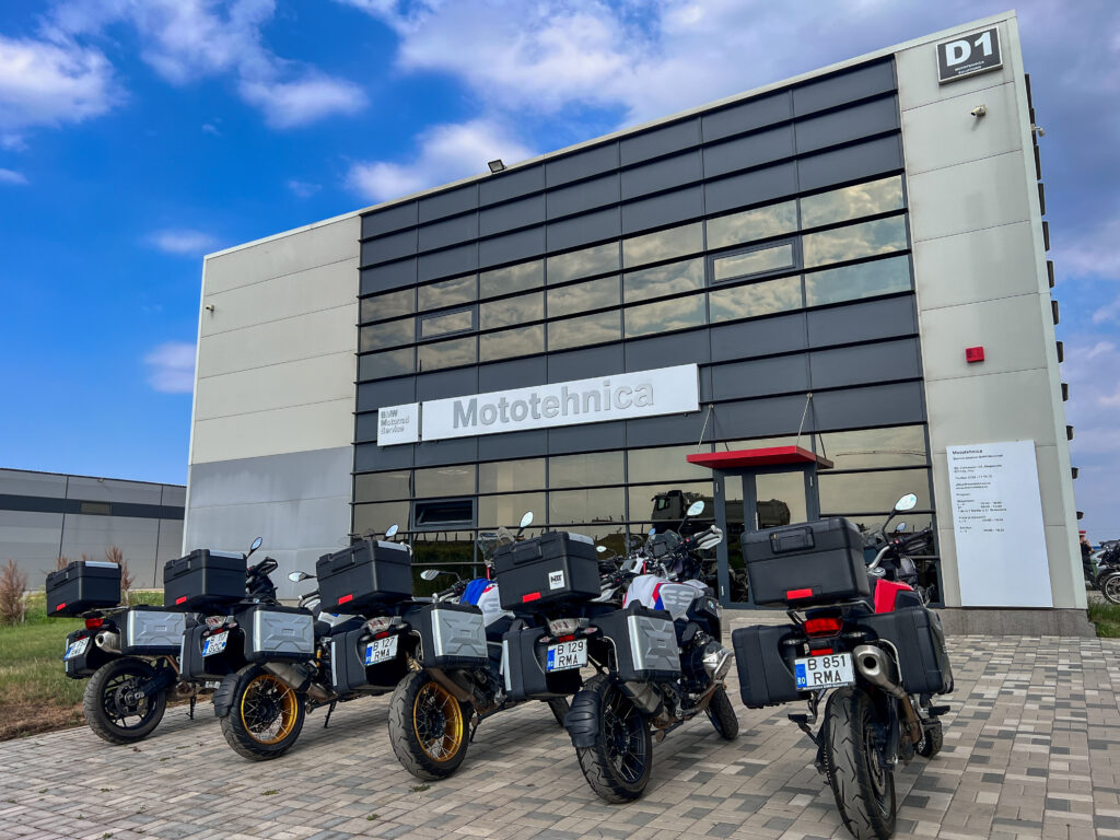Fully equipped BMW GS rental motorcycles parked at MotoTehnica BMW Motorrad Service in Bucharest, Romania